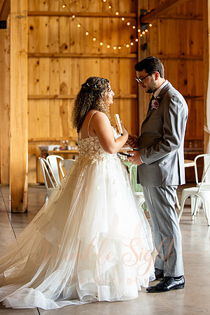 Bride and groom portraits by the water at Grace on the Lake