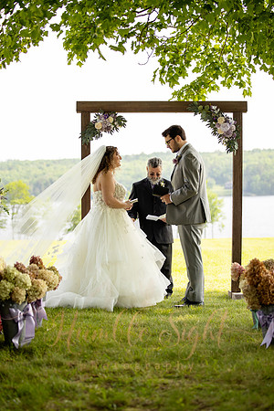Bride and groom portraits by the water at Grace on the Lake