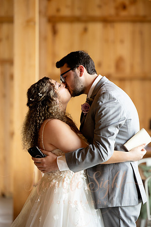 Bride and groom portraits by the water at Grace on the Lake