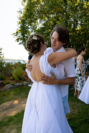 Bride and groom portrait on dock at Swan Lake Maine in August