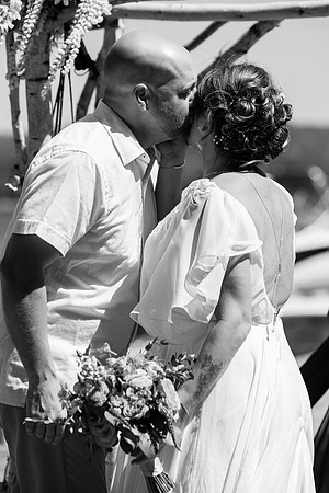 Newlyweds celebrating at lakeside wedding in Swanville Maine