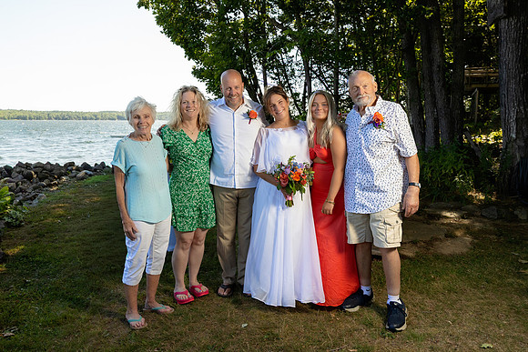 Bride and groom portrait on dock at Swan Lake Maine in August