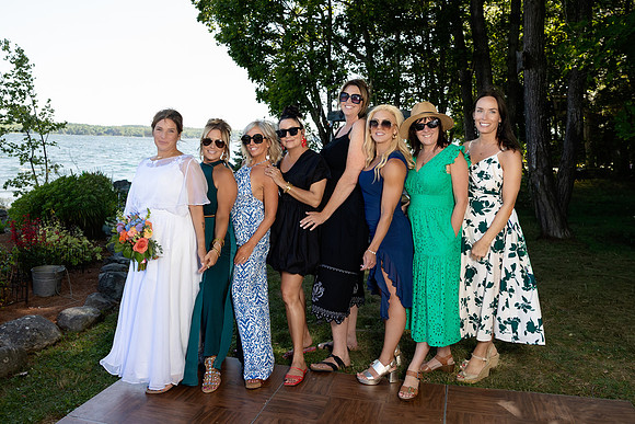 Wedding reception under tent at private waterfront home in Maine