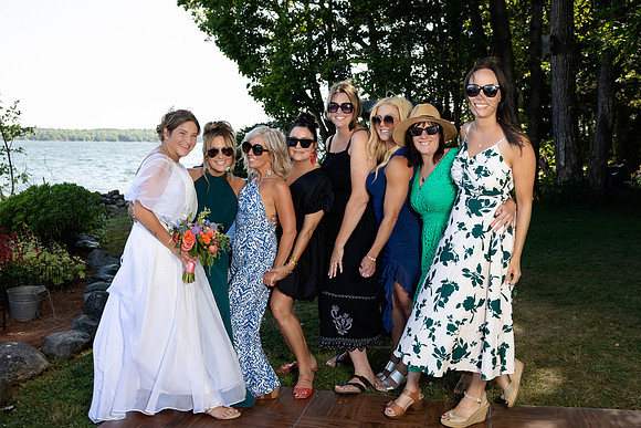 Wedding reception under tent at private waterfront home in Maine