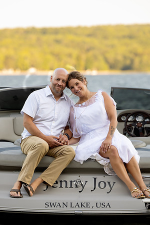 Bride and groom portrait on dock at Swan Lake Maine in August