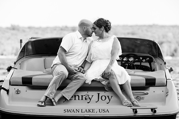 Newlyweds celebrating at lakeside wedding in Swanville Maine