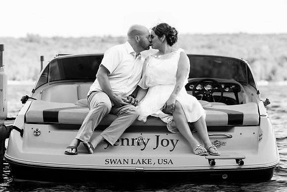 Newlyweds celebrating at lakeside wedding in Swanville Maine
