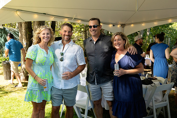 Wedding reception under tent at private waterfront home in Maine