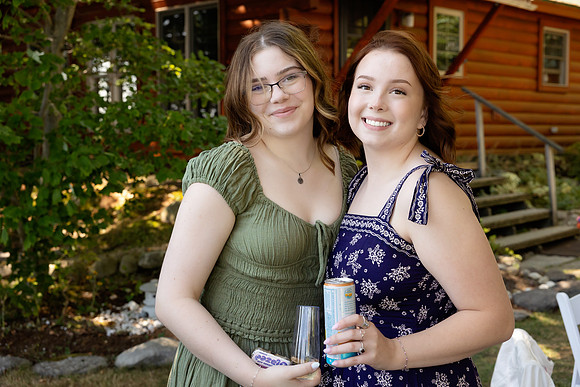Jenny and Bracy Hood arriving by boat for their Swan Lake Maine wedding ceremony