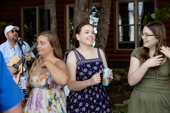 Bride and groom portrait on dock at Swan Lake Maine in August