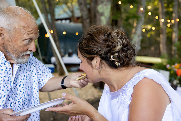 Bride and groom portrait on dock at Swan Lake Maine in August