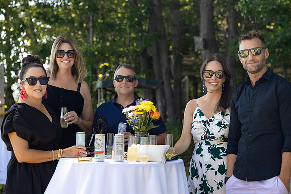 Wedding reception under tent at private waterfront home in Maine