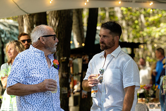 Wedding reception under tent at private waterfront home in Maine