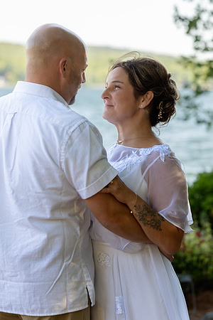 Bride and groom portrait on dock at Swan Lake Maine in August