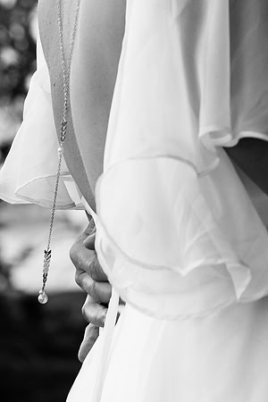 Bride and groom portrait on dock at Swan Lake Maine in August