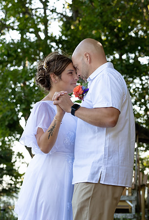 Newlyweds celebrating at lakeside wedding in Swanville Maine