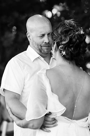 Jenny and Bracy Hood arriving by boat for their Swan Lake Maine wedding ceremony