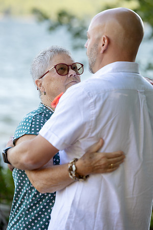 Newlyweds celebrating at lakeside wedding in Swanville Maine