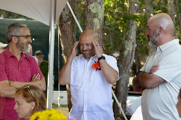 Intimate lakeside wedding ceremony at private home in Swanville Maine