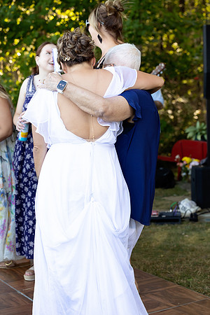 Jenny and Bracy Hood arriving by boat for their Swan Lake Maine wedding ceremony