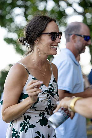 Jenny and Bracy Hood arriving by boat for their Swan Lake Maine wedding ceremony
