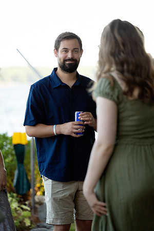 Bride and groom portrait on dock at Swan Lake Maine in August