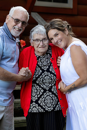 Newlyweds celebrating at lakeside wedding in Swanville Maine