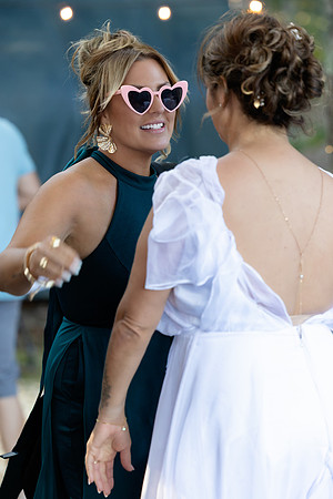 Jenny and Bracy Hood arriving by boat for their Swan Lake Maine wedding ceremony