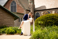Groom dipping bride outside All Souls Congregational Church in Bangor Maine garden