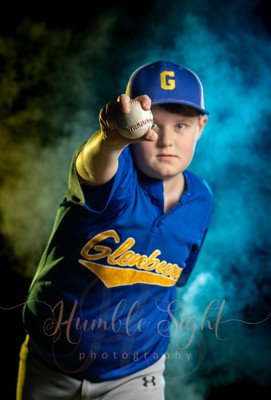 Maine baseball athlete sportrait with dramatic team color lighting
