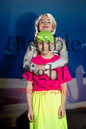 Actors in SpongeBob costumes performing on stage