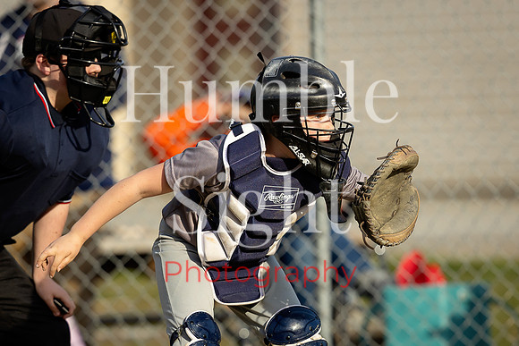 Little League pitcher throwing during game in Holden Maine