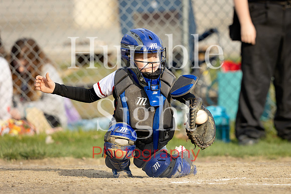 Little League pitcher throwing during game in Holden Maine