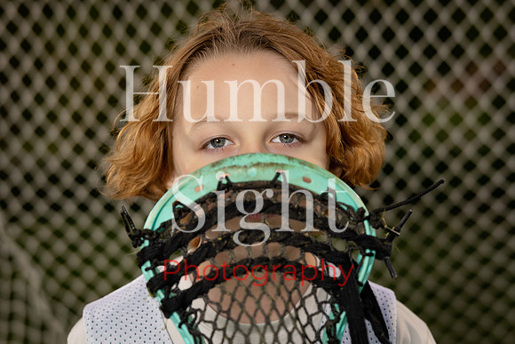 Dynamic sports portrait with lacrosse gear