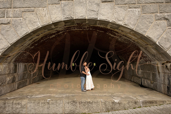 Adventurous engagement photos at Maine stone fortress