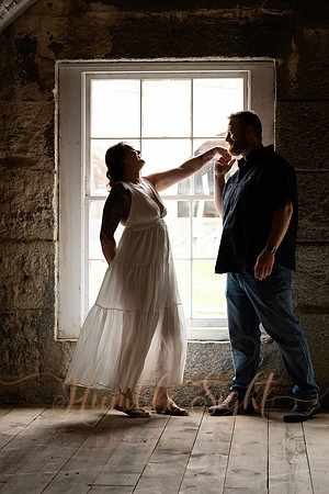 Adventurous engagement photos at Maine stone fortress