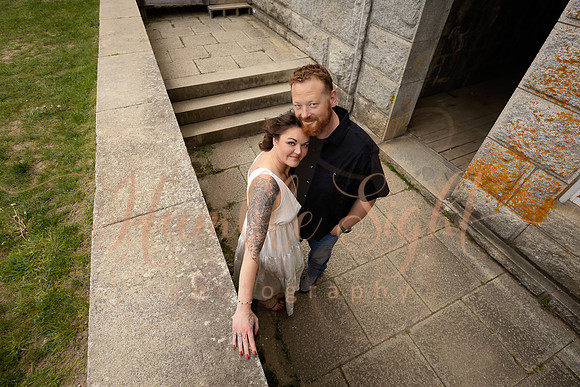 Adventurous engagement photos at Maine stone fortress