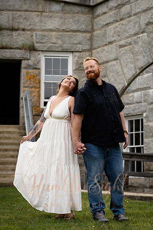 Adventurous engagement photos at Maine stone fortress