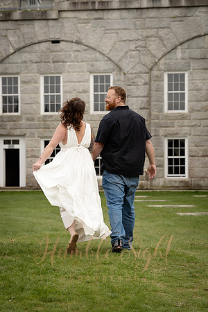 Adventurous engagement photos at Maine stone fortress