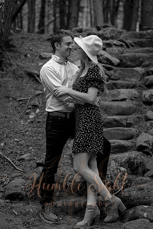 Couple embracing at sunset during Maine engagement shoot