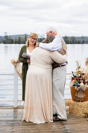 King Hewes wedding on dock at Cold Stream Pond in Enfield Maine