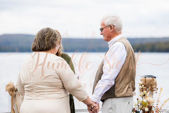 King Hewes wedding on dock at Cold Stream Pond in Enfield Maine