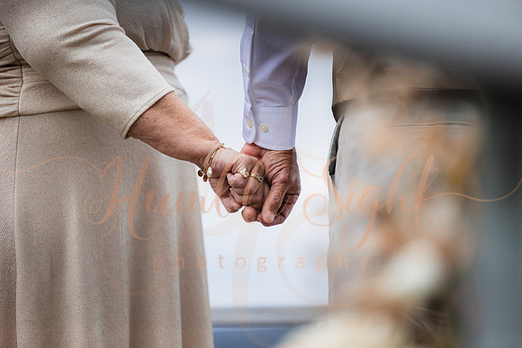 Bride and groom on dock in Maine lake wedding