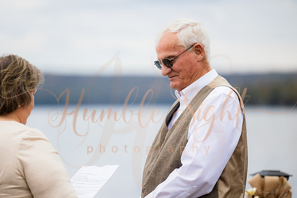 King Hewes wedding on dock at Cold Stream Pond in Enfield Maine
