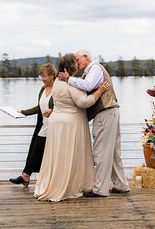 King Hewes wedding on dock at Cold Stream Pond in Enfield Maine