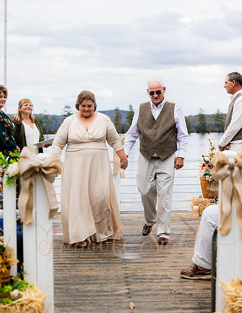 King Hewes wedding on dock at Cold Stream Pond in Enfield Maine