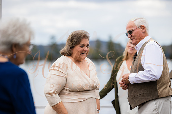 King Hewes wedding on dock at Cold Stream Pond in Enfield Maine