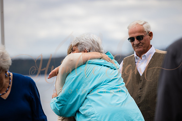 King Hewes wedding on dock at Cold Stream Pond in Enfield Maine