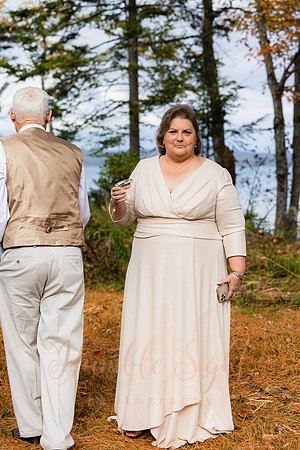 King Hewes wedding on dock at Cold Stream Pond in Enfield Maine