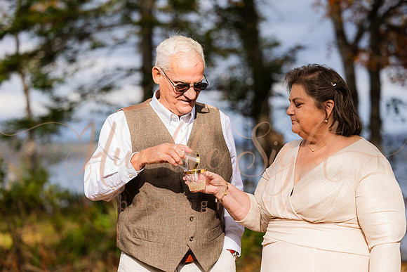 Bride and groom on dock in Maine lake wedding